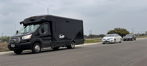 autonomous shuttle, MKZ, and Acura in row on road