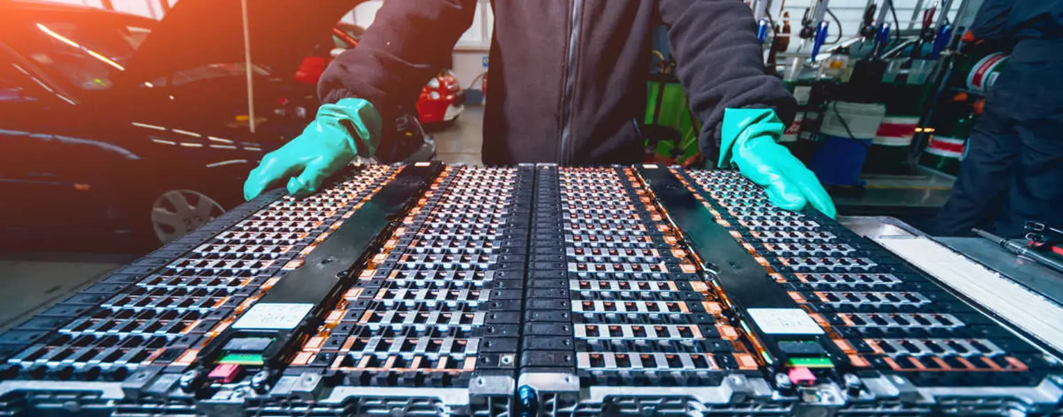 Person changing the batteries on an electric motor