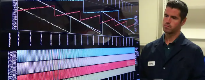 Team member observing data on a large display