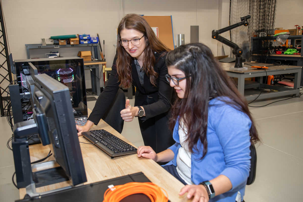 SwRI Engineers Meera Day Towler and Lily Baye Wallace collaborate on a project in the new Space Robotics Center