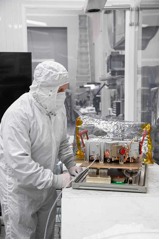 Scientist using an Ultraviolet Spectrograph (UVS) instrument