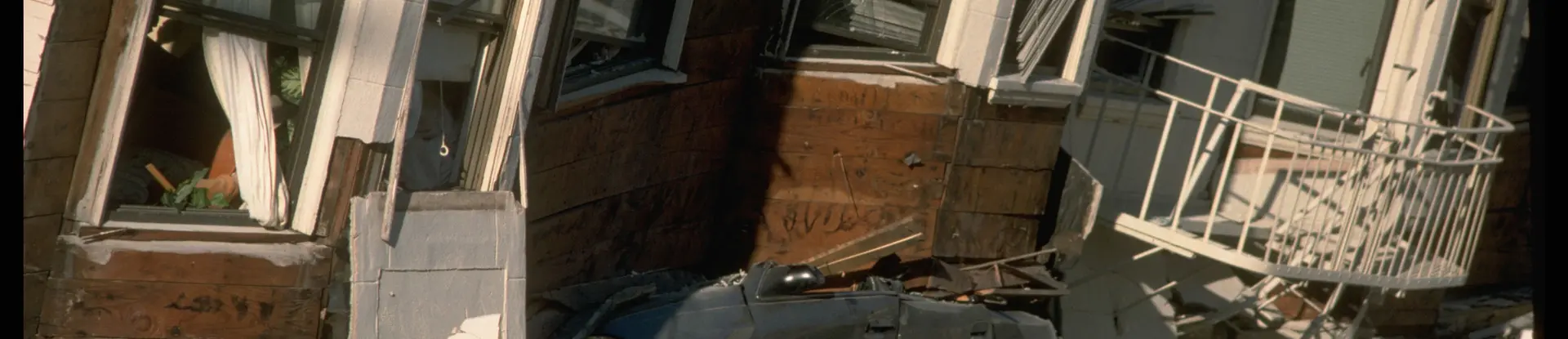 Automobile crushed under building after 1989 Loma Prieta earthquake in California