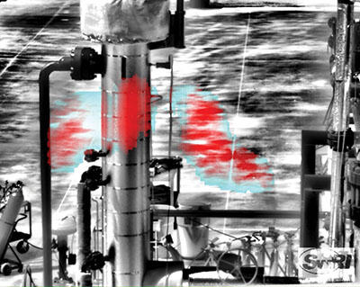 black and white image with red and blue plumes of gas shown