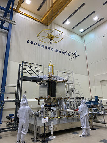 Scientist working on Lucy in a clean room