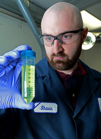 Engineer holding a vaccine