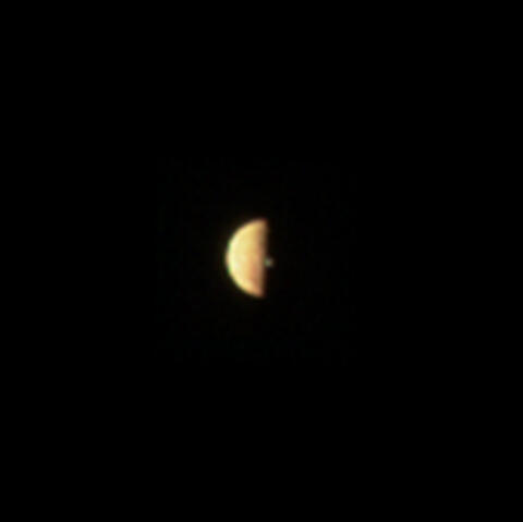 JunoCam image showing a volcanic plume illuminated beyond the terminator