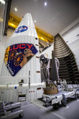 The Lucy spacecraft being tucked into the launch vehicle fairing