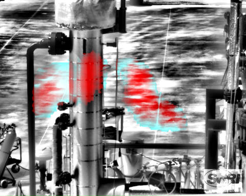 Black and white industrial piping with a blue and red plume of methane in the middle 