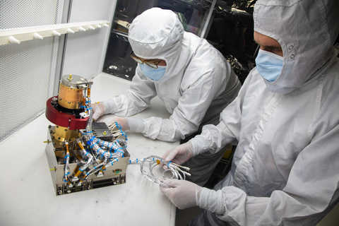 SwRI staff preparing the Solar Wind Plasma Sensor (SWiPS) for integration into a National Oceanic and Atmospheric Administration (NOAA) satellite