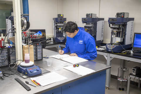 Engineer working in the tribology testing laboratory