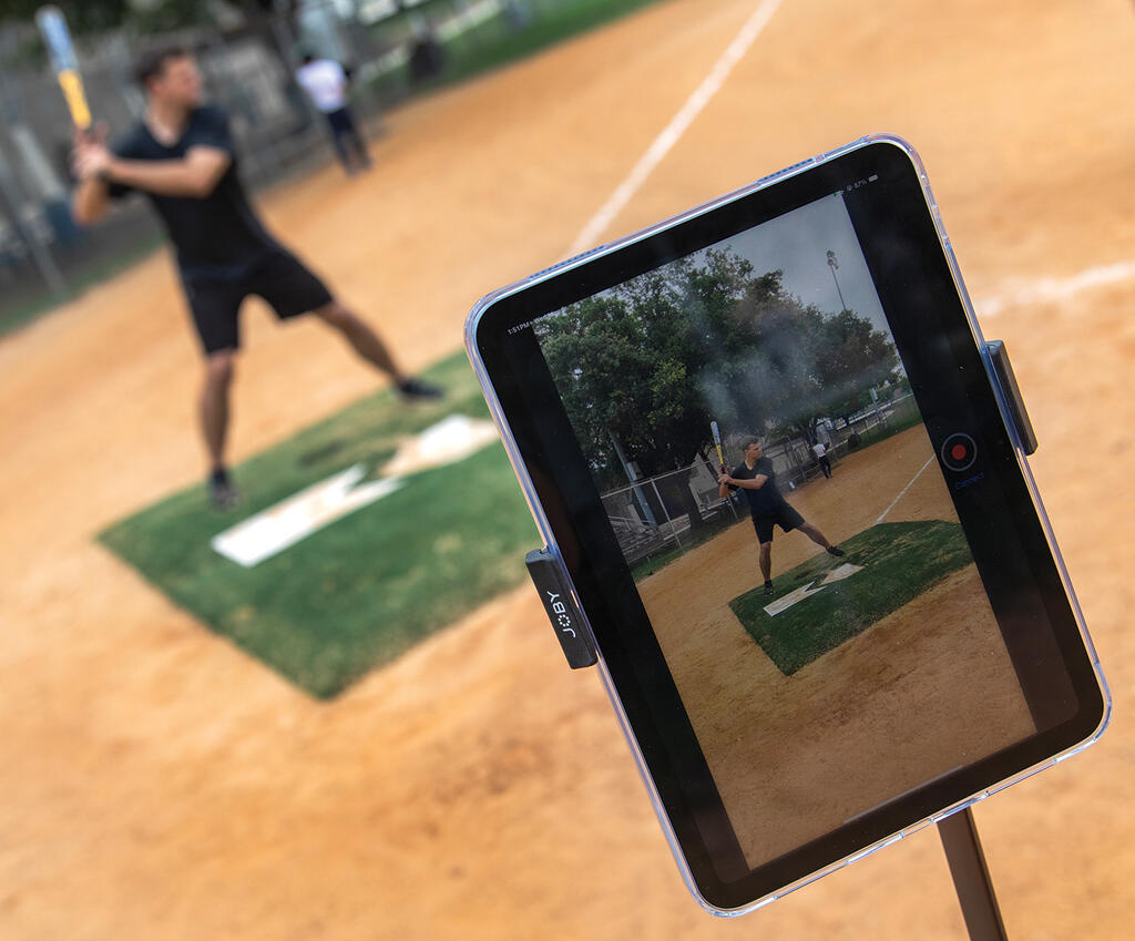 View of tablet with ENABLE software capturing man swinging a baseball bat