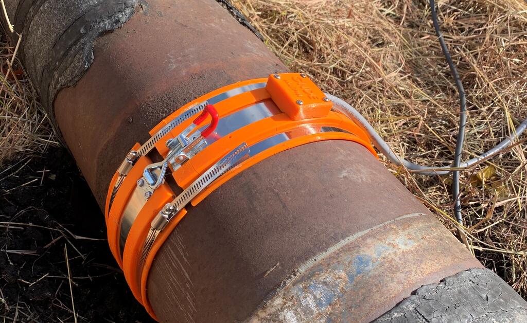 Close up of MsT-PM sensor installed on a buried pipe